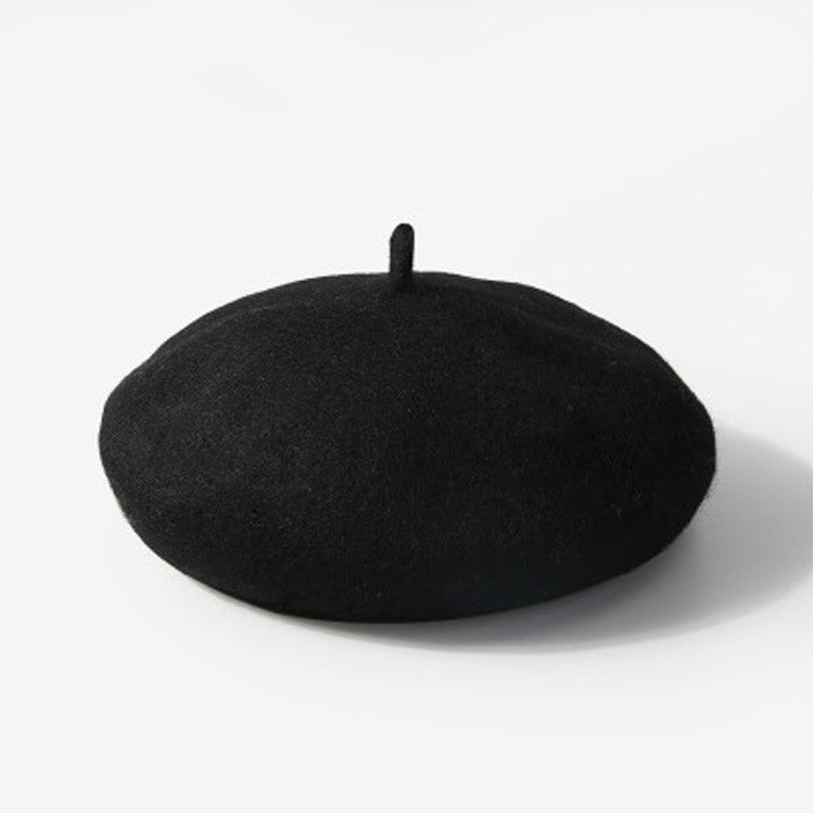 Black beret on a white background