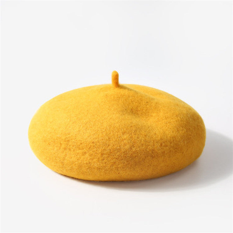 Yellow beret on a white background
