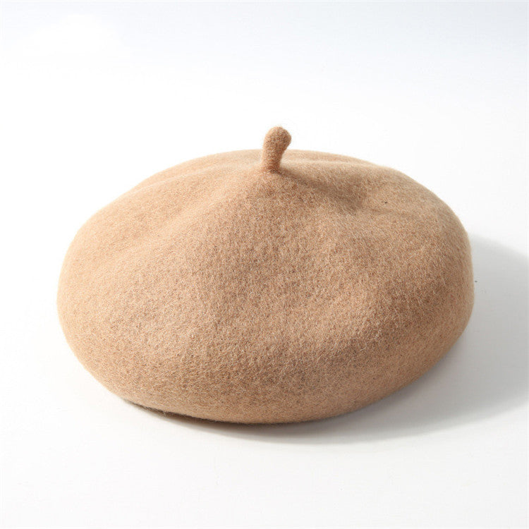 Beige beret on a white background
