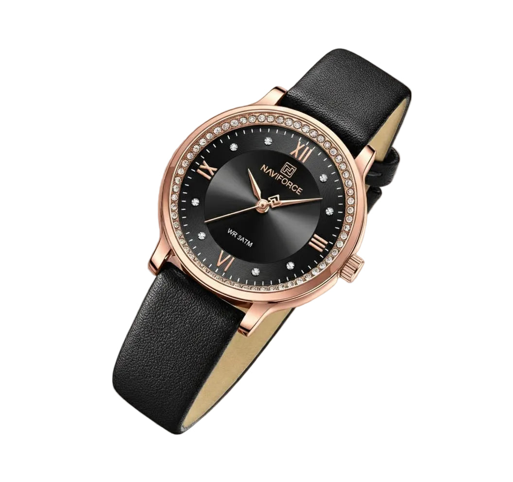 Black wristwatch with rose gold accents on a soft pink background