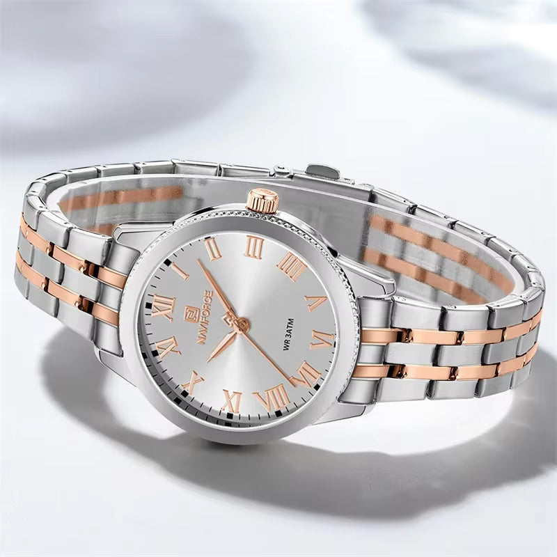 Silver and rose gold watch with Roman numeral markers on a light gray background