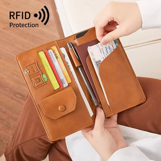 Brown leather wallet with card slots and a pen, held by a person, with 'RFID Protection' text.