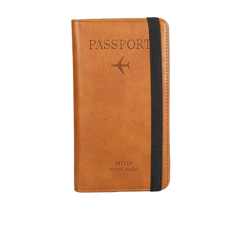 Brown passport holder with black strap on a white background