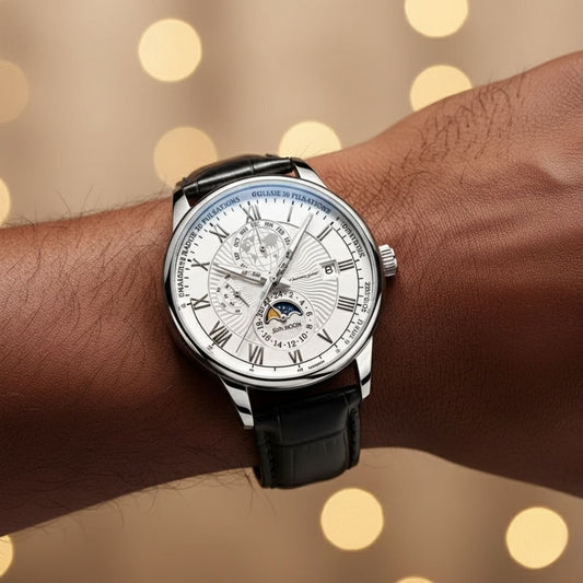 Wrist wearing a black wristwatch with a detailed face against a blurred background