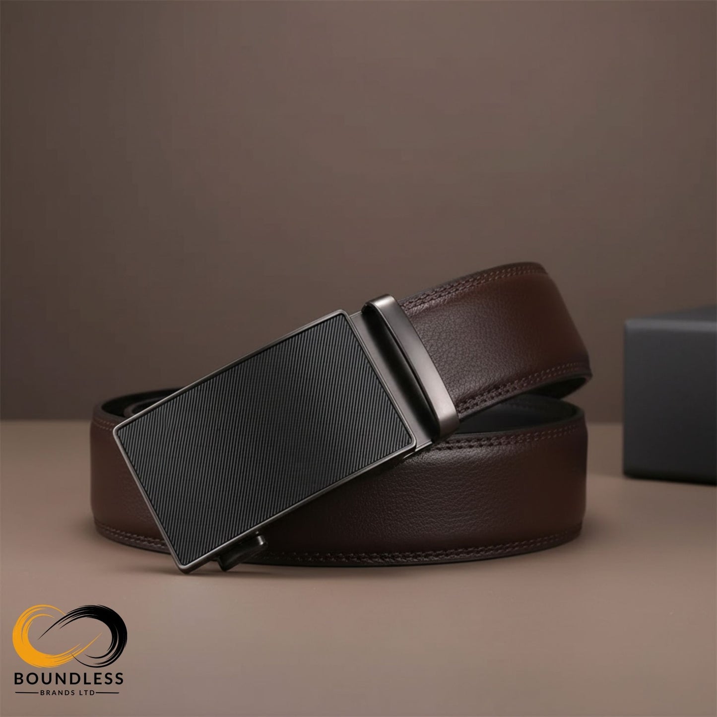 Brown leather belt with a black buckle on a brown background