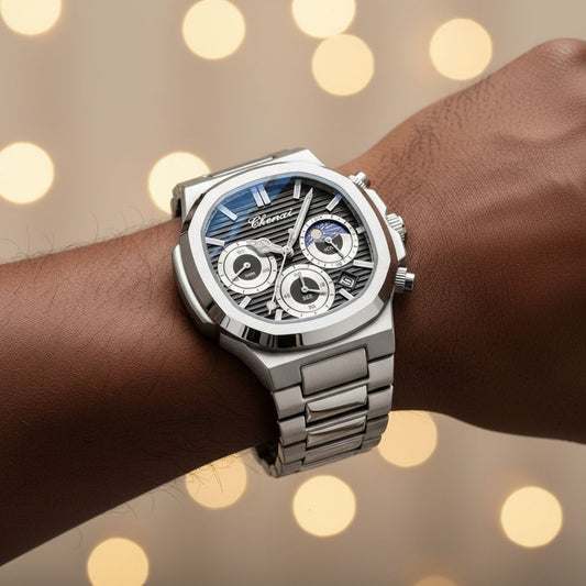 Silver watch on a wrist with a blurred bokeh background