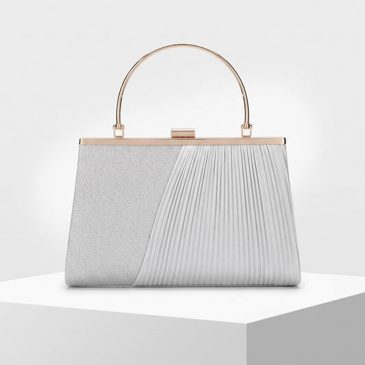 A structured evening clutch bag with a dual-texture design, featuring a glittery silver left panel and a pleated white right panel, with a gold-tone metal handle and frame.