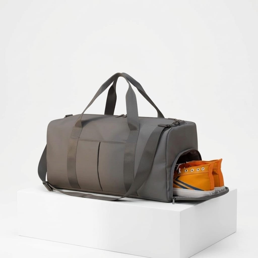 Gray duffel bag with a shoe inside on a white background