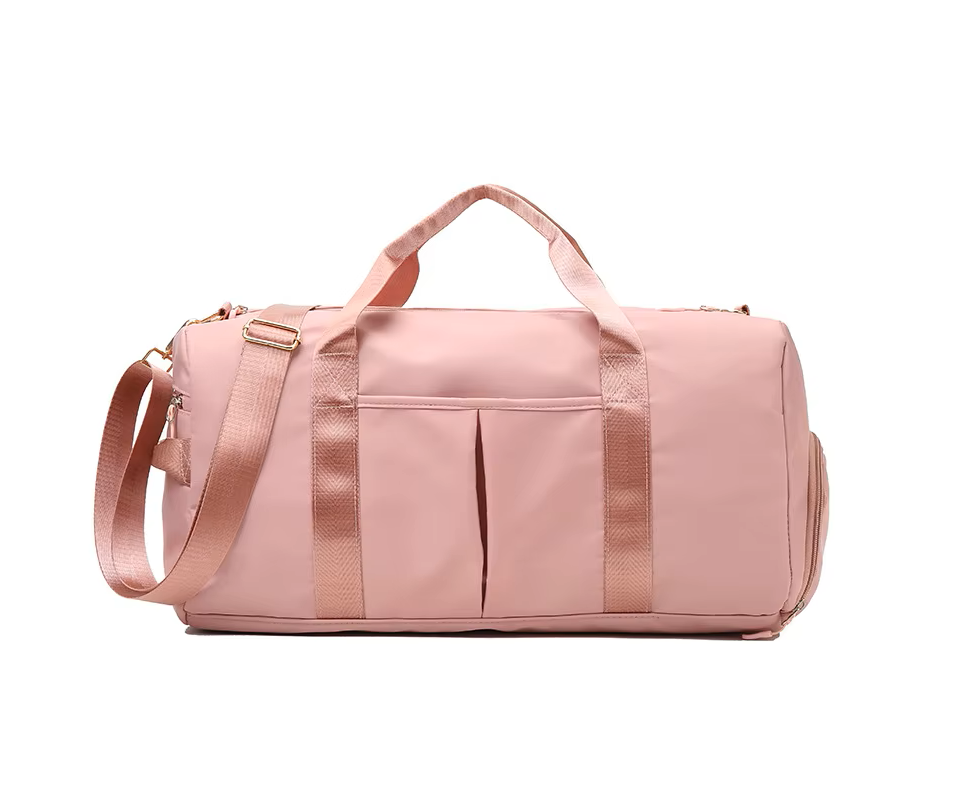Pink duffel bag with a shoulder strap on a white background