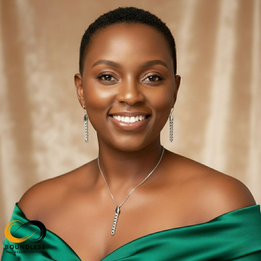 Woman wearing a green off-shoulder top and silver jewelry against a beige background