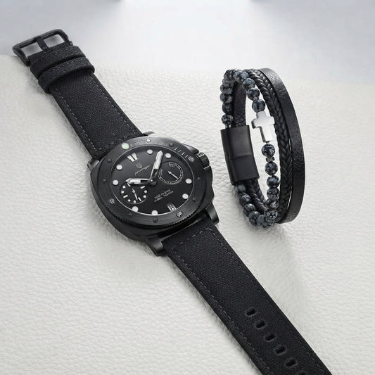 A black men's watch with a textured strap and a matching black beaded bracelet, displayed on a light textured surface.