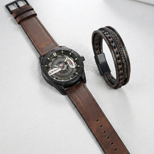 A men's wristwatch with a brown leather strap and black case, shown alongside a matching braided leather bracelet on a light textured background.
